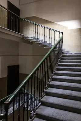 a spiral staircase in a building with a stair railing at Casa Matteo53 Termini - Castro Pretorio in Rome