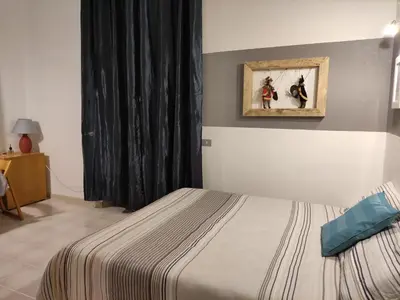 a bedroom with a bed and a painting on the wall at Casa Mariella Quartiere Trionfale - Prati in Rome