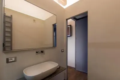 a bathroom with a sink and a mirror at Fontana di Trevi Roma Luxury Suite in Rome