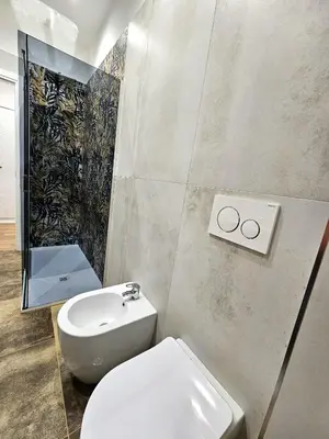 a bathroom with a toilet and a sink at Ricettiva Cipro San Pietro e Musei Vaticani in Rome