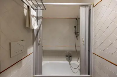 a bathroom with a shower and a bath tub at River61 - Guest House in Rome