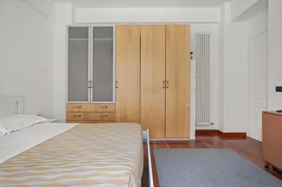 a bathroom with a white tub and a glass shower at 543 Appia Avenue - Metro A by RHR in Rome