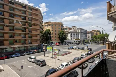 a bedroom with a bed and a wooden cabinet at 543 Appia Avenue - Metro A by RHR in Rome