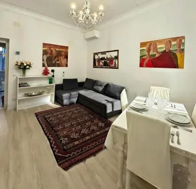 a living room with a couch and a table at Gorgeous Flat In Pigneto in Rome