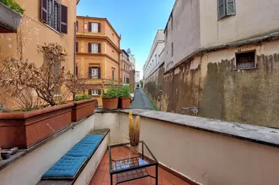 a view of an alley in a city with buildings at Charming loft with terrace at the Quirinale in Rome