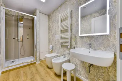 a bathroom with a sink and a toilet and a shower at ROME'S GLORIA HOTEL in Rome