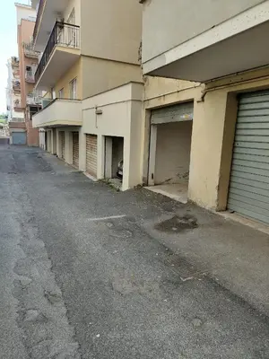 an empty street in front of an apartment building at St Peter 1- Pretty Cozy Apartment (50m from metro) in Rome