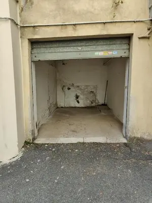 a garage door in the side of a building at St. Peter - Loft at 50m from Metro (up to 4) in Rome