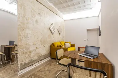 an office with a desk and a laptop on a table at Daplace - Elena Apartment in Rome