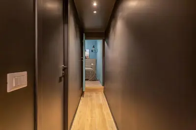 a hallway with a door leading to a room at Daplace - Elena Apartment in Rome