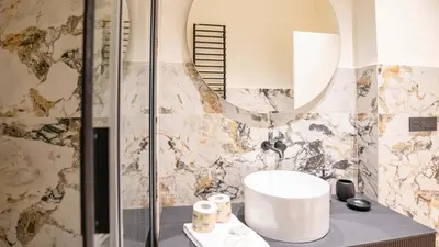a bathroom with a sink and a shower at Pinciana - Veneto - Marilyn House in Rome