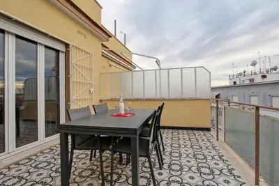 a black table and chairs on the balcony of a building at Design Monteverde Flat in Rome