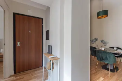 a room with a door and a table and a desk at Cattaneo monti delizioso e nuovissimo appartamento in Rome