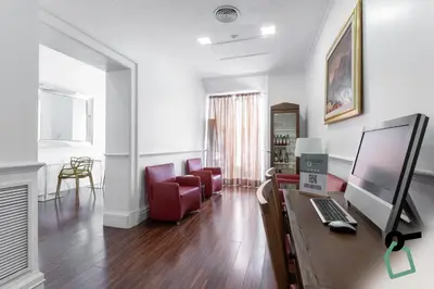 a living room with a desk with a computer on it at HOTIDAY Room Collection - Roma Porta Pia in Rome
