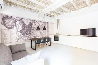 a living room with a couch and a table at Campo 13 Holiday Apartment in Rome