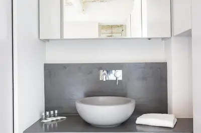 a bathroom with a large white bowl sink on a counter at Campo 13 Holiday Apartment in Rome