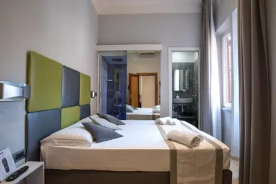 a bedroom with a large bed in a room at Pantheon Caesar Relais in Rome