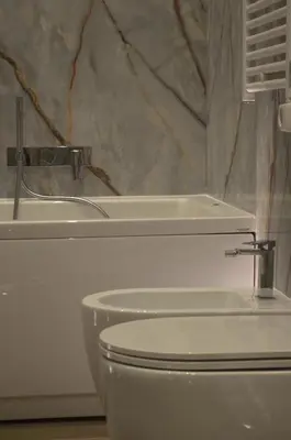 a bathroom with two soap dispensers on a sink at PRIVATE LUXURY FONTANA DI TREVI in Rome