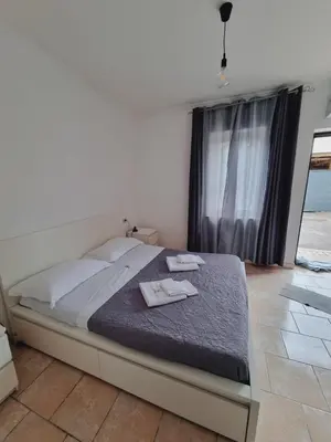 a bedroom with a bed with two towels on it at Borgo Dei Centurione in Rome