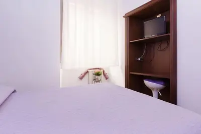 a kitchen with an american flag under a sink at Cozy apartment in Rome