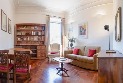 a living room with a couch and a table at Casa di Amici alla Garbatella in Rome