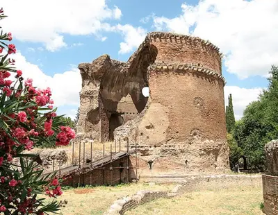 an old building with a tower in a field at A casa di zia Anna in Rome