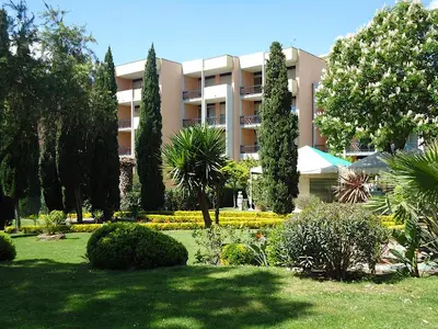 a large apartment building with trees and a garden at Domus Aurelia Luxury in Rome
