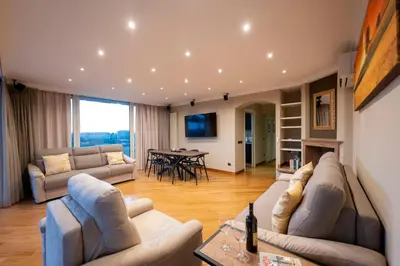 a living room with two couches and a table at Domus Aurelia Luxury in Rome