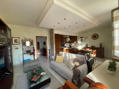 a living room with a couch and a table at Roma Battistini 66 Apartment, near Vatican City in Rome