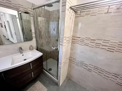 a bathroom with a shower and a sink at White Mary House for two people in Rome