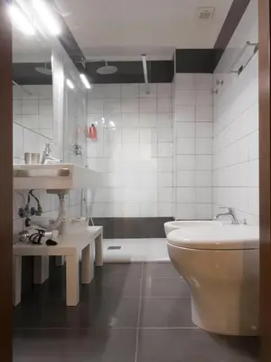 a bathroom with a sink and a toilet and a tub at Domus 1886 (Quartiere Prati) in Rome