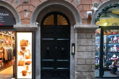 a store with a black door in front of a store at Pantheon Charming Accommodation in Rome
