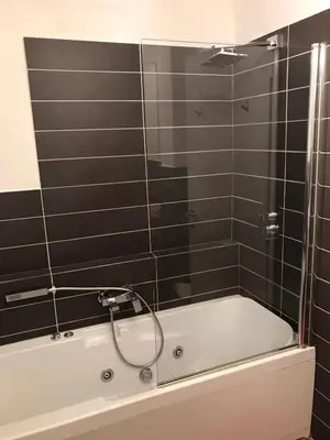 a bathroom with a bath tub with a shower at Villa Borghese Domus in Rome