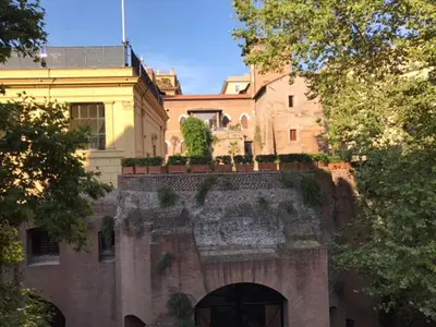 a building with an archway in front of a building at Villa Borghese Domus in Rome