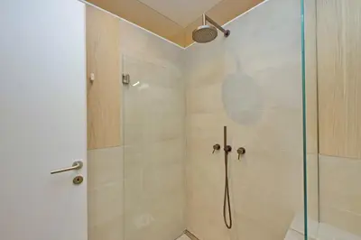a bathroom with a shower with a glass door at YCH-Casa Indipendente in zona Prati in Rome