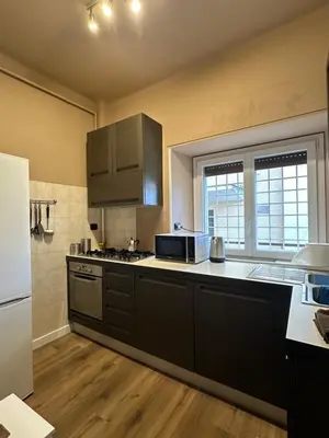 a kitchen with stainless steel appliances and a counter top at Civico Nove al Colosseo in Rome