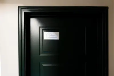 a black door with a sign on it at Studio Margherita in Rome