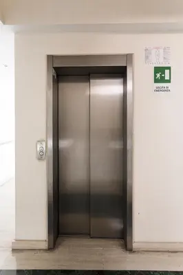 a metal elevator door in a building at Studio Margherita in Rome
