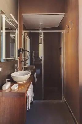 a bathroom with a sink and a shower at The Place Giuliana in Rome