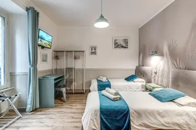 a hospital room with two beds and a desk at Kira Luxury Apartment with terrace in Rome
