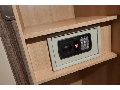 a microwave oven embedded in a wooden cabinet at Window On Rome in Rome