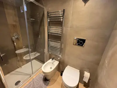 a bathroom with a toilet and a shower and a sink at GetRoma apartment Vatican Museum in Rome