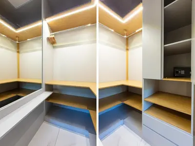 a walk in closet with wooden shelves and blue cabinets at Aurelia Boutique Apartment in Rome