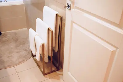 a bathroom with white towels hanging on a door at Chic and Elegant Apartment in the heart of Rome in Rome