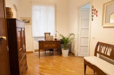 a room with a desk with a laptop on it at Cicerone 60 in Rome