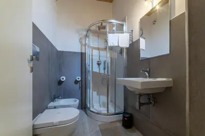 a bathroom with a shower and a toilet and a sink at Major 93 Guesthouse in Rome