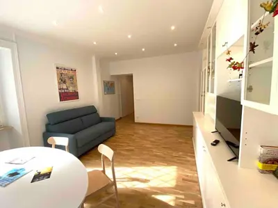a living room with a couch and a table at Vacanze Romane in Rome