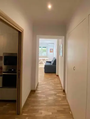 a hallway leading to a living room with a couch at Vacanze Romane in Rome
