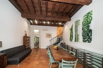 a living room with a table and a couch at Campo De Fiori Home in Rome