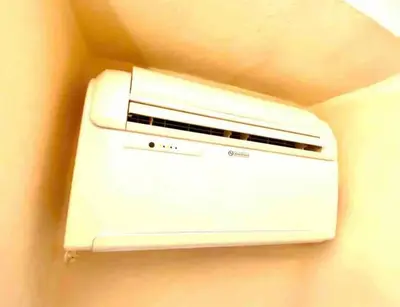 a white toaster is hanging on a wall at Vacanze Romane al Portico d'Ottavia in Rome
